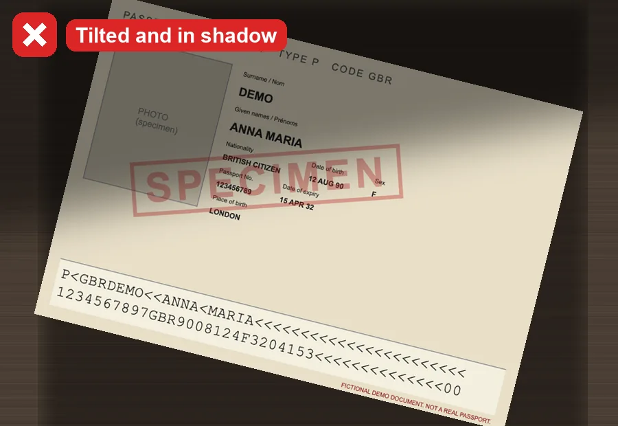 A tilted passport photo partly in shadow