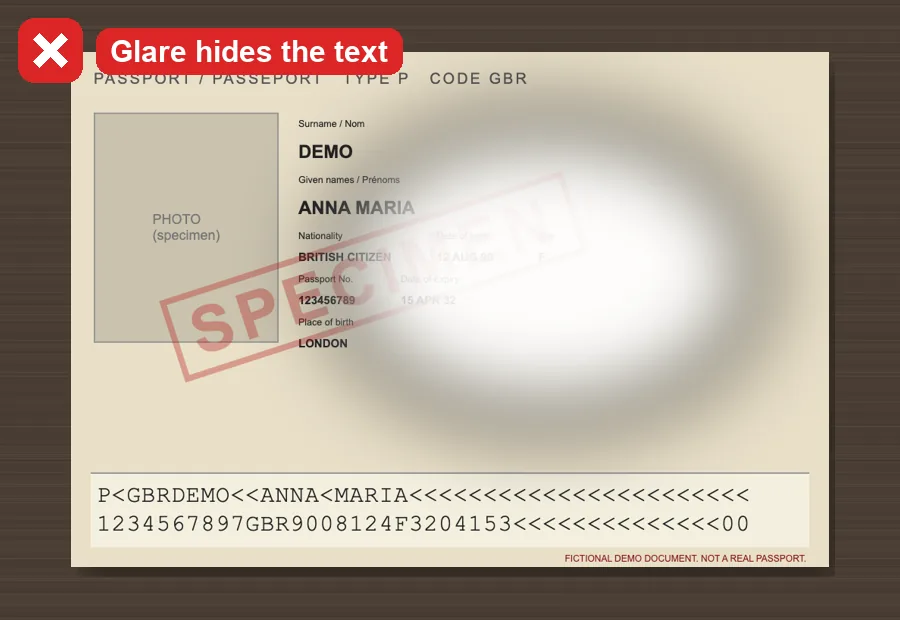 A passport photo with a bright reflection hiding the text
